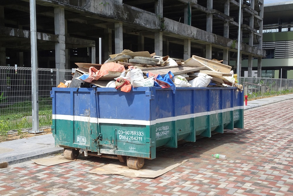 Full Roll off dumpster at a construction site